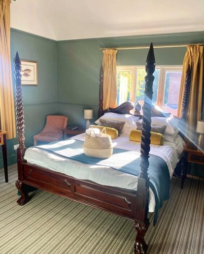 a bedroom with a large bed in a room at The Emsworth in Emsworth