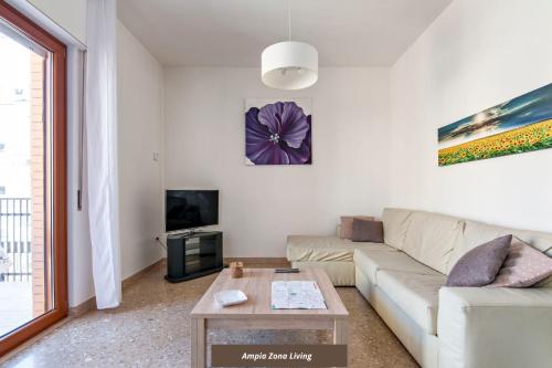 a living room with a couch and a table at Di Palma 4 Family House - Lecce Selection in Lecce