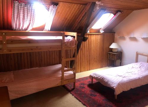 a bedroom with two bunk beds in a room at Les Marronniers 4 chambres in Dinant