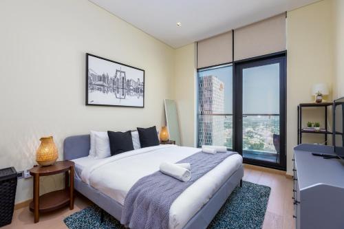 Postel nebo postele na pokoji v ubytování Modern 1BR Apartment, High Floor, Near Dubai Mall