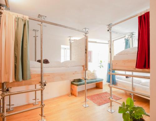 a room with two bunk beds in it at Montagu Hostel in Innsbruck