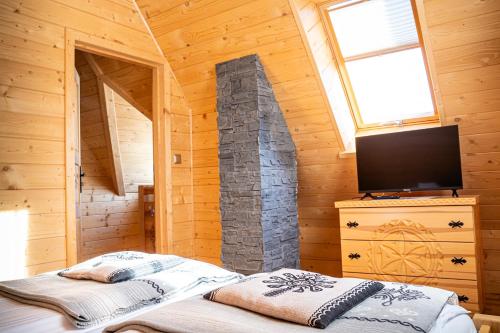 En eller flere senge i et værelse på Góralski House