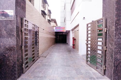 an empty hallway with doors on the side of a building at FabExpress Everest - Nr Vashi in Mumbai