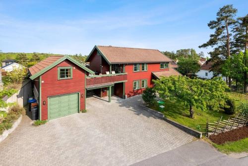 an overhead view of a red house with a garage at La Casa Roja in Sandefjord