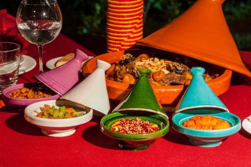 a table topped with different types of food on a table at Riad Sougtani in Marrakech