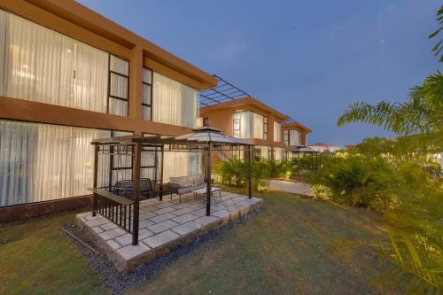 a house with a gazebo in front of it at The Fern Heaven on The Hills Resort, Hatgad-Saputara in Surgāna