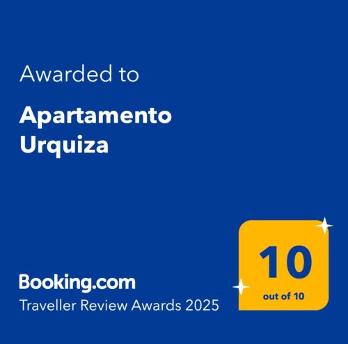 a yellow sign that reads awarded to apartmenturiuriuriuriira travel review awards at Apartamento Urquiza in San Carlos de Bariloche