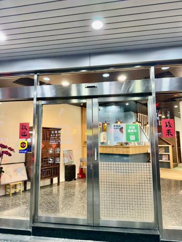 an entrance to a store with a sliding glass door at 鄉都文旅 in Jiaoxi