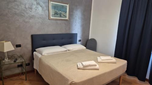 Letto o letti in una camera di Hotel Le Tre Stazioni