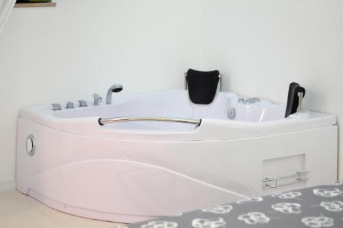 a white toilet in a room with a sink at La Bella Trani - Suites and B&B in Trani