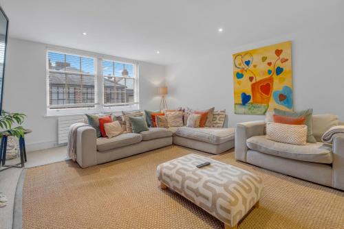 a living room with two couches and a rug at The Jade Suite - The Jewellery Suites, 3 bed 3 bath in Birmingham