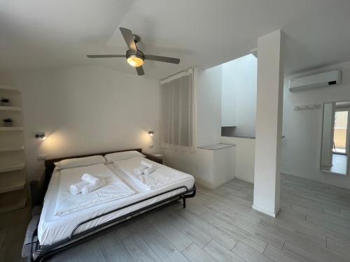 Ένα ή περισσότερα κρεβάτια σε δωμάτιο στο Cà Rita Apartments