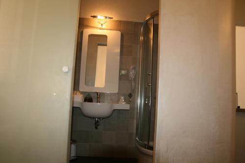 a bathroom with a sink and a mirror at B&B Mini Hotel Incity-close train station and port- in Salerno