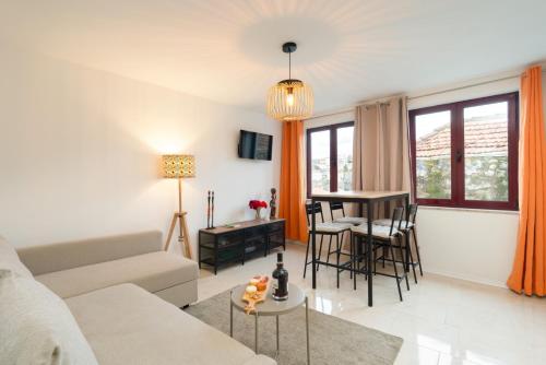 a living room with a couch and a table at HostWise - Artistic Escape with Modern Comfort in Vila Nova de Gaia