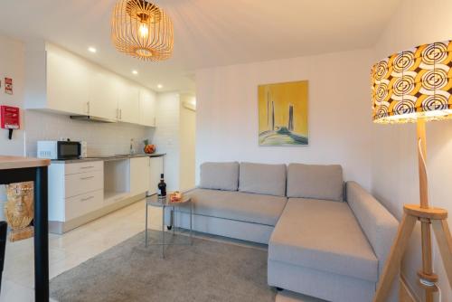 a living room with a couch and a table at HostWise - Artistic Escape with Modern Comfort in Vila Nova de Gaia