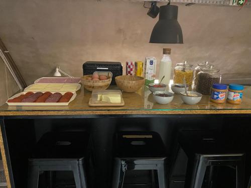 a counter with a bunch of ingredients on it at Main Square Hostel in Zagreb