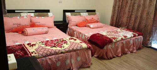 Giường trong phòng chung tại Kinmen 988 Homestay