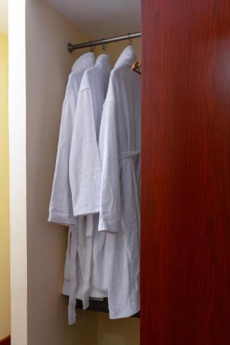 a group of white shirts hanging on a rack at Dreamliner Hotel in Addis Ababa
