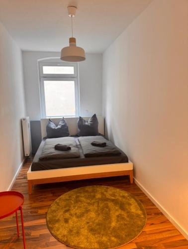 Postel nebo postele na pokoji v ubytování NEW Apartment in Magdeburg Buckau - Waschmaschine, Smart-TV, neues Badezimmer