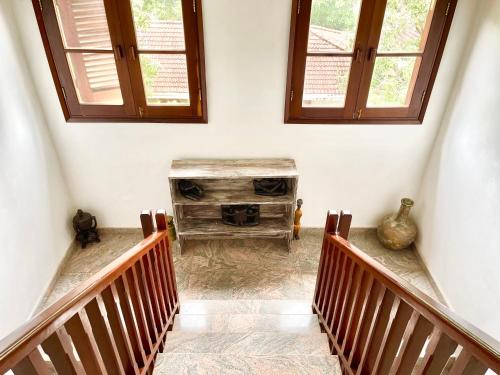 a stairway with a wood stove in a room at VITA'S BEACH House in Diani Beach