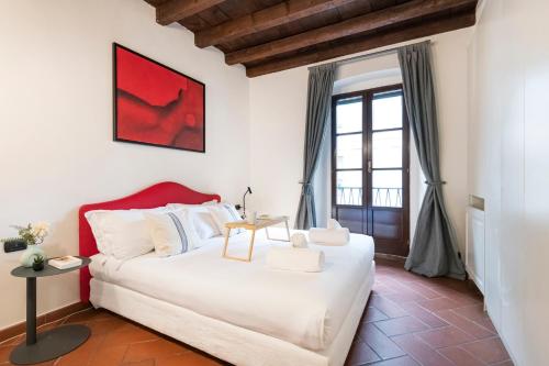 Posteľ alebo postele v izbe v ubytovaní Prestigioso appartamento Piazza Duomo by Easylife