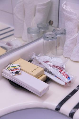 a tray of toothbrushes and other items on an airplane at Dreamliner Hotel in Addis Ababa