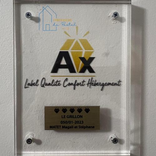 a sign for aaa on a wall in a room at Le Grillon de Pongo Elegant T2 avec balcons in Ax-les-Thermes