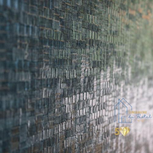 a close up of the side of a brick wall at Le Grillon de Pongo Elegant T2 avec balcons in Ax-les-Thermes