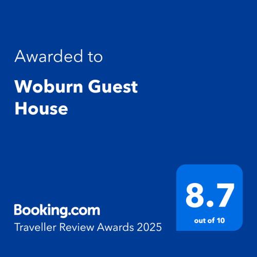 a blue sign with the text awarded to workflow guest house at Woburn Guest House in Chartwell