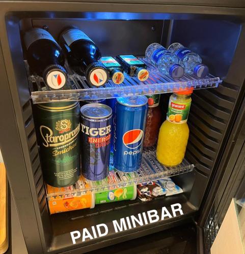 a refrigerator filled with lots of soda and drinks at Sauna studio near centre/airport in Prague