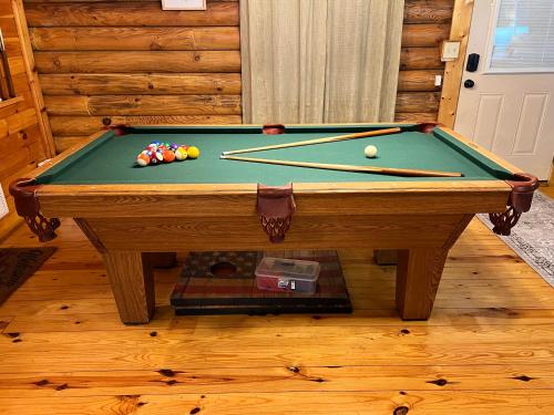 a pool table with balls on top of it at Bear Nakid in Pigeon Forge