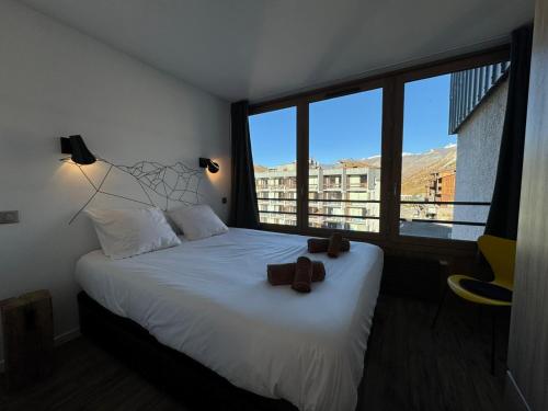 Ένα ή περισσότερα κρεβάτια σε δωμάτιο στο PLA134 - SUPERBE Appt 4-6pers traversant coeur val Claret