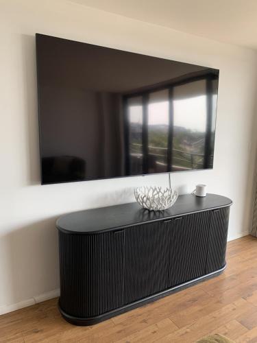 a black coffee table in a room with a mirror at 6415 Midnight Pass #307 in Siesta Key