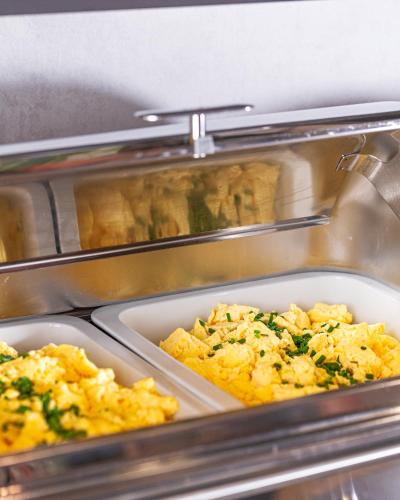 a buffetaration of food in a cafeteria withultsults at Altstadt Hotel Hofwirt Salzburg in Salzburg