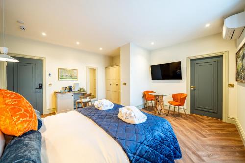 a bedroom with a bed and a table and chairs at St Marys Quarters in Nottingham