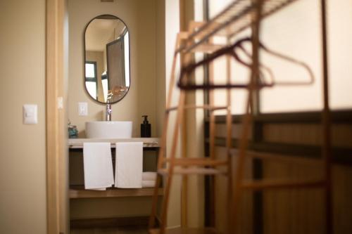 a bathroom with a sink and a mirror at El Consuelo in Oaxaca City
