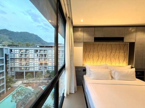 Postel nebo postele na pokoji v ubytování Citygate Kamala Resort