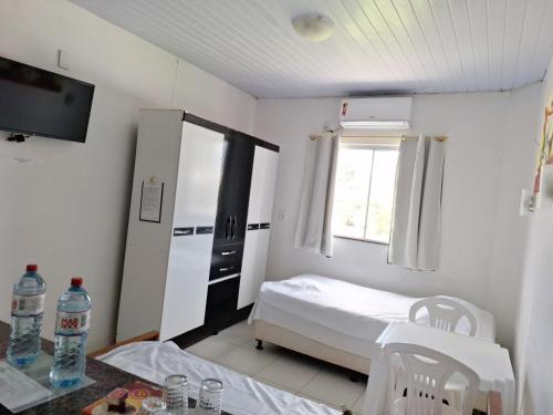 Postel nebo postele na pokoji v ubytování Residencial Dom Fernando