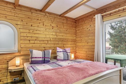 Katil atau katil-katil dalam bilik di Holzhaus am Waldrand