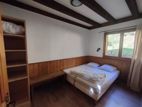 Ένα ή περισσότερα κρεβάτια σε δωμάτιο στο Chalet Le Pré Caro