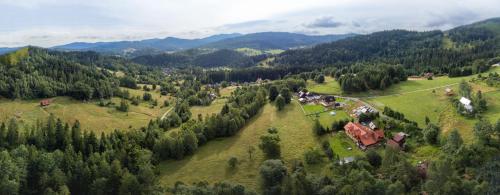 an aerial view of a village in the mountains at Apartamenty Monika SPA i Agroturystyka in Korbielów
