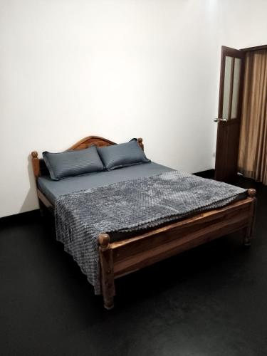 Ένα ή περισσότερα κρεβάτια σε δωμάτιο στο Senaya Homestay