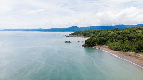 an aerial view of a beach and the ocean at La Martina Ecolodge in Nuquí