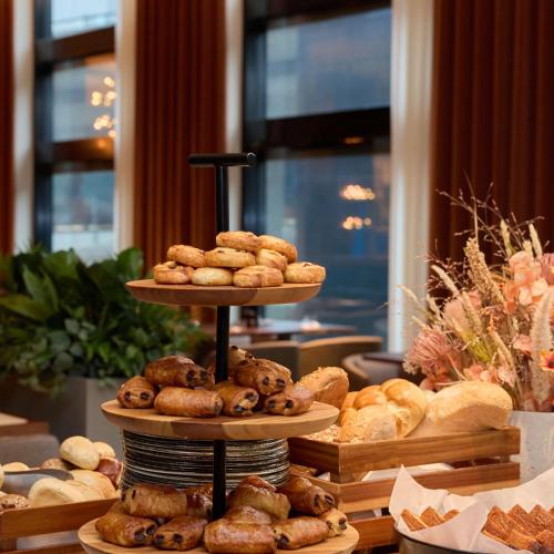 a display of different types of pastries on a table at Radisson Blu Hotel Zurich Airport in Kloten