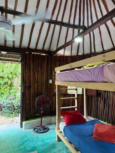 Ένα ή περισσότερα κρεβάτια σε δωμάτιο στο Tree House Tulum