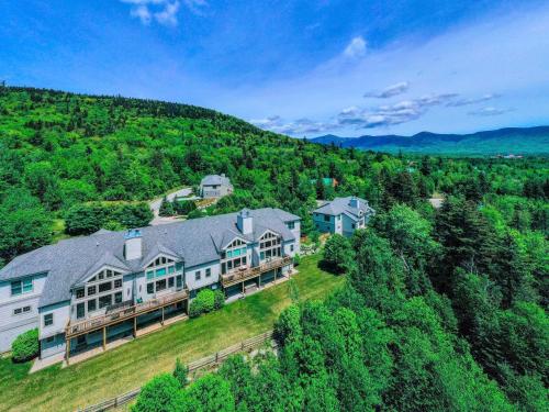 an aerial view of a large house on a hill at H4 Ski Slope Views! Bretton Woods condo with easy access to Mt Washington, Skiing, White Mountains! in Carroll