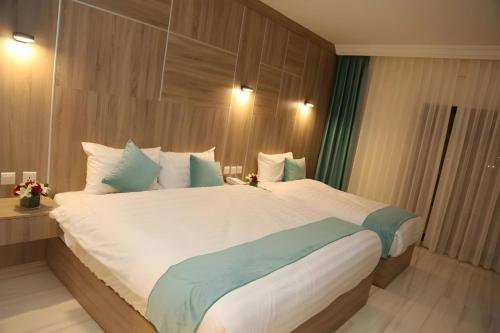 Кровать или кровати в номере Turquoisejo Hotel