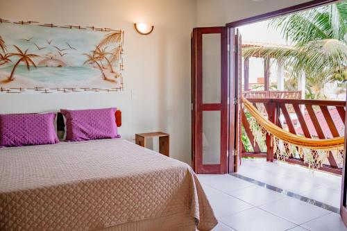 Postel nebo postele na pokoji v ubytování Pousada Coral de Fogo