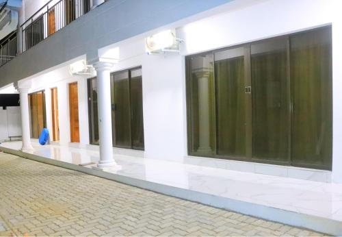 a building with large windows on the side of it at Musina Crown Guest House in Musina