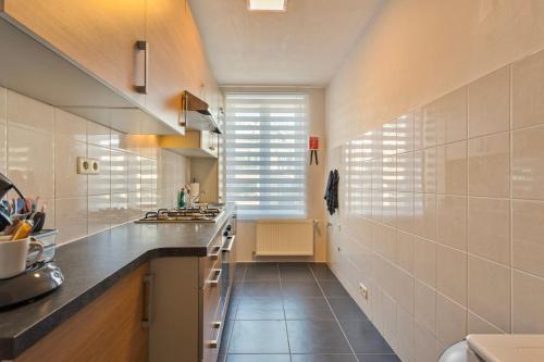 Kuchyň nebo kuchyňský kout v ubytování B&B Leopold & Appartementen